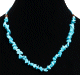 Collier ethnique artisanal imitation quartz turquoise agrémentée de perles bleues et en bois Collier ethnique artisanal imitation quartz turquoise agrémentée de perles bleues et en bois